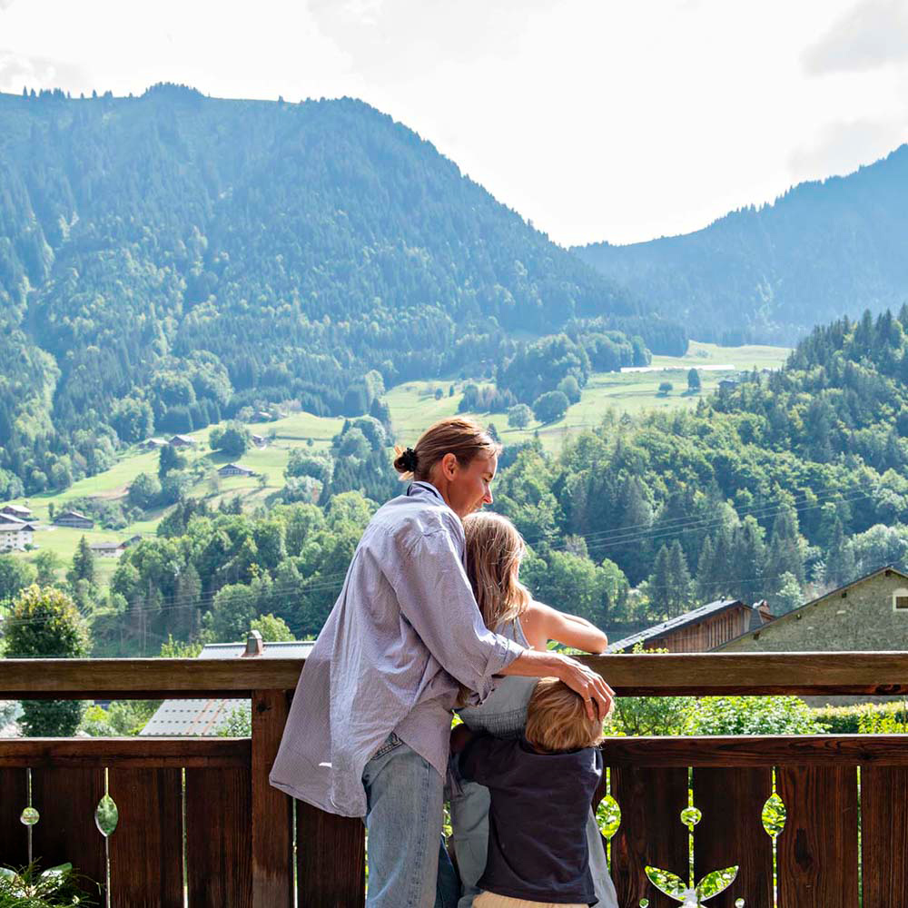 Family looking at view on balcony